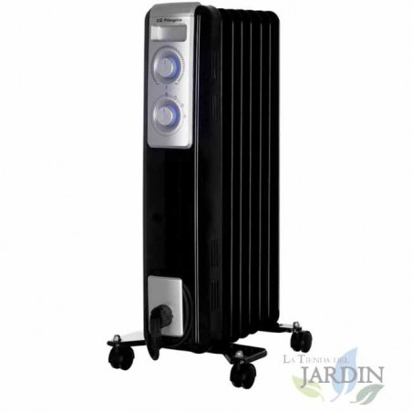 Riscaldatore ad olio con 7 elementi. Tre potenze di riscaldamento: 600 W - 900 W - 1500 W. Termostato regolabile