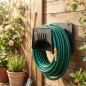 Plastic support for irrigation hoses