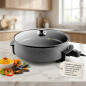 Orbegozo 1500W electric pot ideal for frying, stewing, roasting, cooking paellas, tortillas and pizzas. 40 cm diameter. Backg Orbegozo 1500W electric pot ideal for frying, stewing, roasting, cooking paellas, tortillas and pizzas. 40 cm diameter. Backg