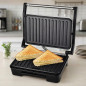 Sanduicheira Panini Grill de 850W | Grelha Elétrica Multiuso Antiaderente | Abertura de 90° | Pés Antiderrapantes | Toque Frio Sanduicheira Panini Grill de 850W | Grelha Elétrica Multiuso Antiaderente | Abertura de 90° | Pés Antiderrapantes | Toque Frio